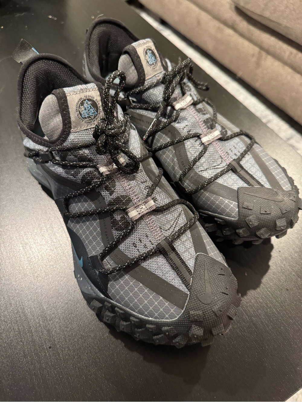Nike Men's Gray and Black Trail Sneakers with Subtle Blue Logo